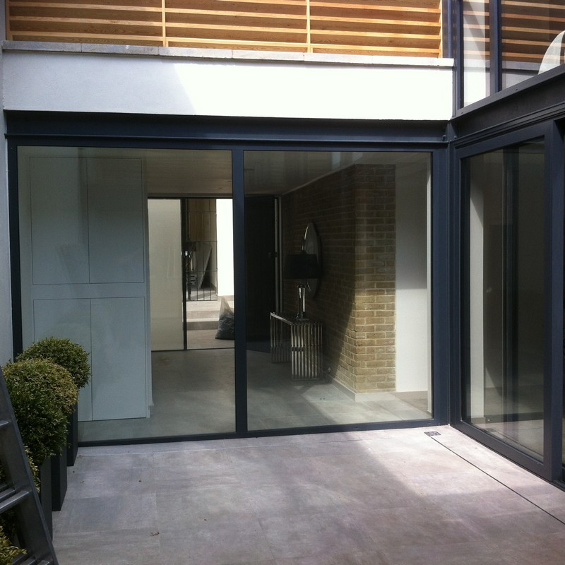 Floor-to-ceiling sliding doors opening to courtyard in Hampton