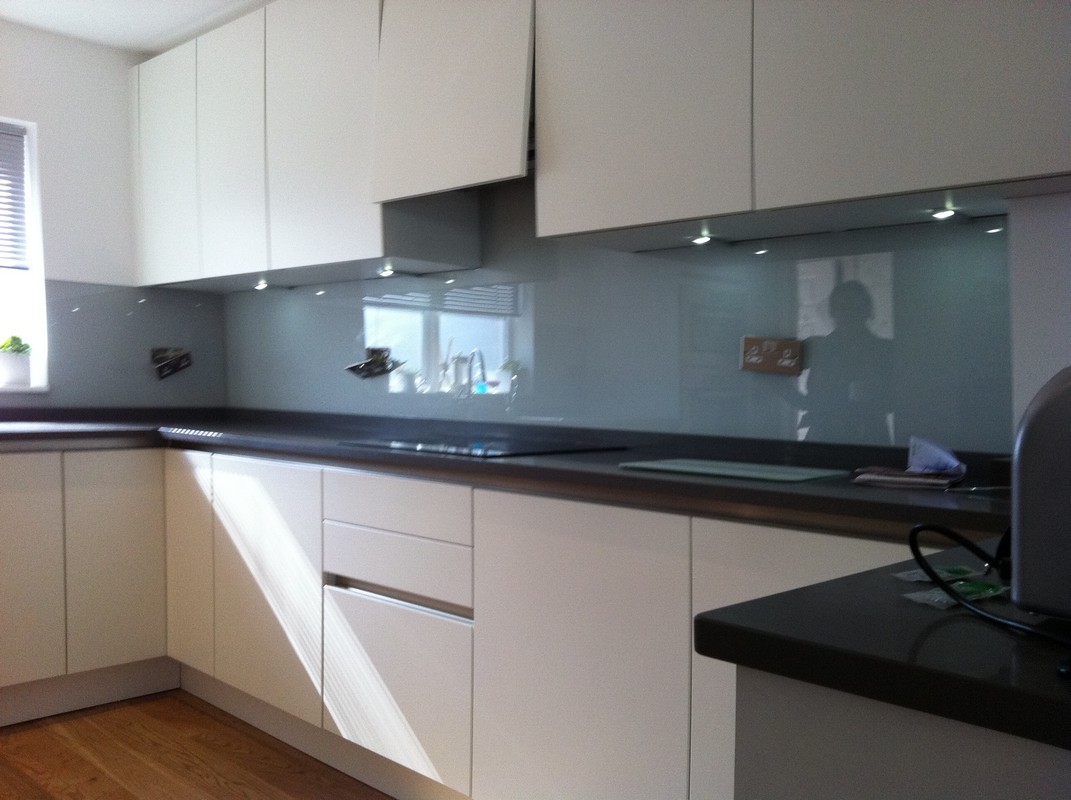 Grey glass kitchen splashback with LED lighting in Hampton